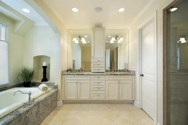 Bathroom with warm neutral wall colors and crisp white trim by a house painter in Sebastian Inlet, FL.
